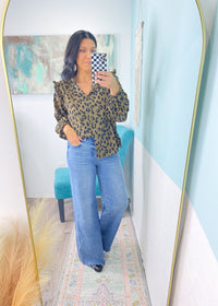 'Wildcat' Ruffle Trim Leopard Print Top-This leopard top is so versatile &amp; can be styled for work &amp; nights out! Wear fully buttoned to show off the ruffle detail or wear unbuttoned under a blazer/sweater for a pop of print. Pairs well with all shades of denim and all neutral colored bottoms.-Cali Moon Boutique, Plainville Connecticut