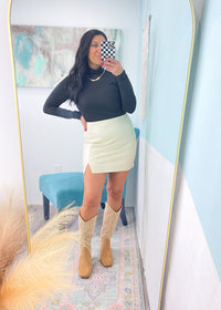 'Runway' Winter White Split Hem Soft Faux Leather Skirt-Turn heads in this super soft faux leather mini skirt! It features a split front detail, back zipper and is super comfy. No crinkle sounds when you walk! Wear all year 'round for nights out and special parties! -Cali Moon Boutique, Plainville Connecticut