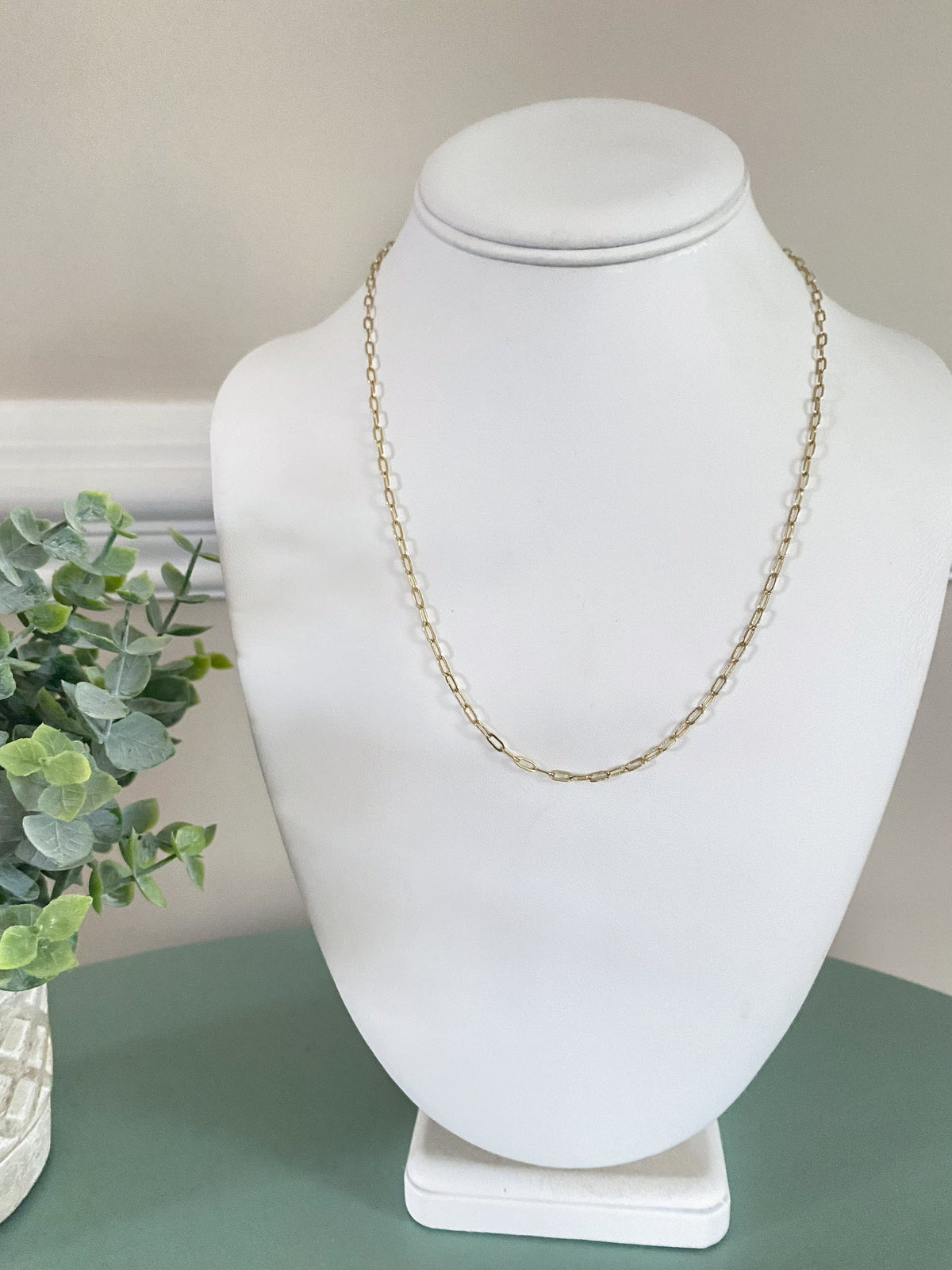 Mini Paperclip Chain Necklace-The perfect mini paperclip necklace! The mini paperclip style is adorable paired by itself as a great classic chain or paired with your favorite charm or initial charm.

-Cali Moon Boutique, Plainville Connecticut