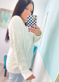 'Charmed' Ivory Cable Sleeve Soft Sweater-Classic cable knit design is perfectly placed in a tonal sleeve on this super soft and cozy sweater. The loose, rounded neckline allows you to wear it regular or slightly off shoulder.

Perfect for: Business casual, night out with boots/jeans, everyday with leggings/jeans with sneakers-Cali Moon Boutique, Plainville Connecticut