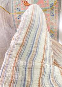 Striped fabric pants  colorful patterned background