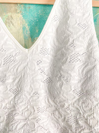 white lace patterned seamless cropped top